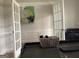 Stylish office space with French doors and a modern desk with decorative basket at 160 Elysian Dr, Fayetteville, GA 30214