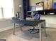Bright office space featuring a modern desk, shelving, and natural light from the window at 160 Elysian Dr, Fayetteville, GA 30214