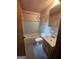 Bathroom with blue tiled walls, shower and tub, vanity with sink, and fixtures at 125 Rosenwald Cir, Stockbridge, GA 30281