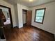 Bedroom featuring hardwood floors and a window for natural light at 125 Rosenwald Cir, Stockbridge, GA 30281