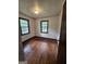 Bedroom with hardwood floors and two windows offering lots of natural light at 125 Rosenwald Cir, Stockbridge, GA 30281