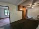 Open-concept kitchen area featuring classic cabinets and a view of the living room at 125 Rosenwald Cir, Stockbridge, GA 30281
