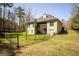 Spacious backyard featuring a fenced yard and deck, perfect for outdoor activities and entertaining at 50 Clear Spring Ct, Oxford, GA 30054