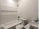 Bathroom featuring a modern vanity, tub with a shower, and sleek fixtures at 50 Clear Spring Ct, Oxford, GA 30054