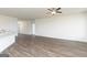 Expansive open-concept living space with hardwood floors, and ceiling fan at 256 Oliver Dr, Locust Grove, GA 30248