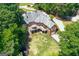 Aerial view of home with deck, fenced yard, in a lush neighborhood with mature tree coverage at 660 Milton Dr, Mcdonough, GA 30252
