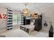 Cozy bedroom with a bunk bed, window, and stylish decor with natural lighting at 660 Milton Dr, Mcdonough, GA 30252