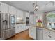 Well-appointed kitchen features stainless steel appliances, granite countertops, and ample cabinet space at 660 Milton Dr, Mcdonough, GA 30252