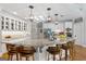 Modern kitchen with a large island, granite countertops, stainless steel appliances, and barstool seating at 660 Milton Dr, Mcdonough, GA 30252