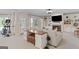 Living room with stone fireplace, built-in shelves, exercise equipment, and comfortable seating at 660 Milton Dr, Mcdonough, GA 30252
