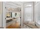 Spacious main bedroom boasts tray ceilings, hardwood floors, and a sitting area with lots of natural light at 660 Milton Dr, Mcdonough, GA 30252