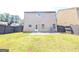 Back exterior featuring a well maintained yard with dark wood privacy fence at 120 Magnaview Dr, Mcdonough, GA 30253