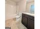 Bathroom with a tub/shower combo, toilet, and single sink vanity with granite countertop at 120 Magnaview Dr, Mcdonough, GA 30253