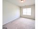 Bedroom featuring neutral walls and carpet, a window with blinds, and a ceiling light at 120 Magnaview Dr, Mcdonough, GA 30253