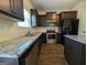 Kitchen with stainless steel appliances, granite counters and dark cabinets at 120 Magnaview Dr, Mcdonough, GA 30253