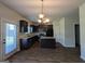 Kitchen with dark cabinetry, stainless steel appliances, granite countertops, and an island at 120 Magnaview Dr, Mcdonough, GA 30253