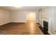 Spacious living room showcasing hardwood floors, a fireplace, and neutral paint at 3796 Wolverton Cir, Lithonia, GA 30038