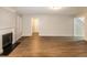 Spacious living room showcasing hardwood floors, a fireplace, and neutral paint at 3796 Wolverton Cir, Lithonia, GA 30038