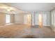 Large primary bedroom features neutral carpet, tray ceiling, walk-in closet, and large windows at 3796 Wolverton Cir, Lithonia, GA 30038