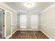 Well-lit office space with hardwood floors, neutral paint, and large windows at 3796 Wolverton Cir, Lithonia, GA 30038