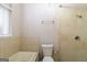 Bright bathroom with a shower and tub, featuring neutral tile and ample lighting at 6290 Shallowford Way, Douglasville, GA 30135
