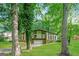 Two-story home featuring lush landscaping, a brick base, and a two-car garage at 6290 Shallowford Way, Douglasville, GA 30135