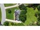 Overhead view of home featuring a lush lawn, landscaping and driveway winding to the street at 127 Rockspray Rdg, Peachtree City, GA 30269