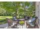Spacious outdoor seating area with wicker furniture, perfect for relaxation and entertaining at 127 Rockspray Rdg, Peachtree City, GA 30269