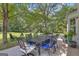 Back patio features outdoor dining area with seating for entertaining at 127 Rockspray Rdg, Peachtree City, GA 30269