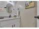 Elegant half bath with shiplap walls, a decorative mirror, and modern fixtures at 127 Rockspray Rdg, Peachtree City, GA 30269
