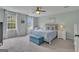 Serene main bedroom with large windows, neutral decor, and a cozy seating area at 127 Rockspray Rdg, Peachtree City, GA 30269