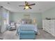 Inviting main bedroom with soft lighting, neutral tones, and a comfortable seating area at 127 Rockspray Rdg, Peachtree City, GA 30269