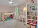 Bright bedroom with carpet, window, lofted bed and stylish furnishings at 127 Rockspray Rdg, Peachtree City, GA 30269