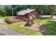 Community clubhouse featuring a large deck, playground, and ample green space for activities at 127 Rockspray Rdg, Peachtree City, GA 30269