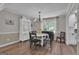 Dining room featuring stylish chandelier, neutral paint and wood floors at 127 Rockspray Rdg, Peachtree City, GA 30269