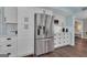 Well-equipped kitchen featuring stainless steel refrigerator and ample cabinet space at 127 Rockspray Rdg, Peachtree City, GA 30269