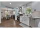 Bright kitchen featuring white cabinets, stainless steel appliances, and an open layout at 127 Rockspray Rdg, Peachtree City, GA 30269