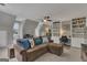 Comfortable living room with a plush sectional sofa, built-in shelves, and natural light at 127 Rockspray Rdg, Peachtree City, GA 30269