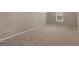 A versatile attic space with neutral walls, trim and carpeting, ready for customization and storage at 409 Brandy Ln, Mcdonough, GA 30253