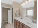 Bathroom showcasing double vanity, spacious counter top and tile flooring at 409 Brandy Ln, Mcdonough, GA 30253