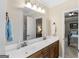 Bathroom with double vanity, neutral color scheme, and updated fixtures at 409 Brandy Ln, Mcdonough, GA 30253