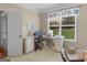 Bright bedroom features a large window, desk space, and a chair for a cozy work or study area at 409 Brandy Ln, Mcdonough, GA 30253