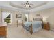 Serene bedroom with tray ceiling, neutral walls, and cozy decor at 409 Brandy Ln, Mcdonough, GA 30253