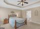 Relaxing bedroom with tray ceiling, neutral colors, and ample natural light at 409 Brandy Ln, Mcdonough, GA 30253