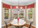 Cozy breakfast nook area featuring bright windows and backyard views for sunny mornings at 409 Brandy Ln, Mcdonough, GA 30253