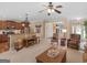 Inviting living room with hardwood floors, comfortable seating, and a view into the entry foyer at 409 Brandy Ln, Mcdonough, GA 30253