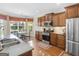 Modern kitchen featuring stainless steel appliances, eat in table, and tile backsplash at 409 Brandy Ln, Mcdonough, GA 30253
