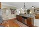 Functional kitchen island with stainless steel dishwasher, granite countertops, and views to Gathering room at 409 Brandy Ln, Mcdonough, GA 30253