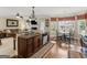 Spacious kitchen island with bar seating, a view of the breakfast nook and an open floor plan at 409 Brandy Ln, Mcdonough, GA 30253