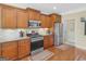 Well-equipped kitchen featuring stainless steel appliances, tile backsplash, and ample cabinetry at 409 Brandy Ln, Mcdonough, GA 30253